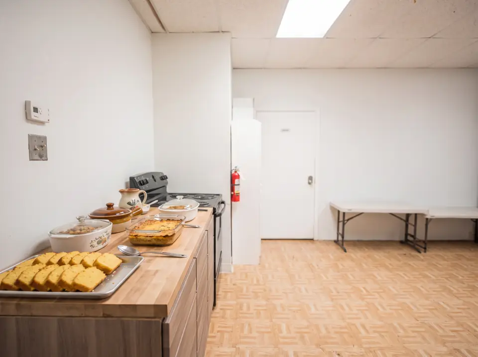 Covered casserole dishes and cornbread on the Sacred Farewells kitchen counter